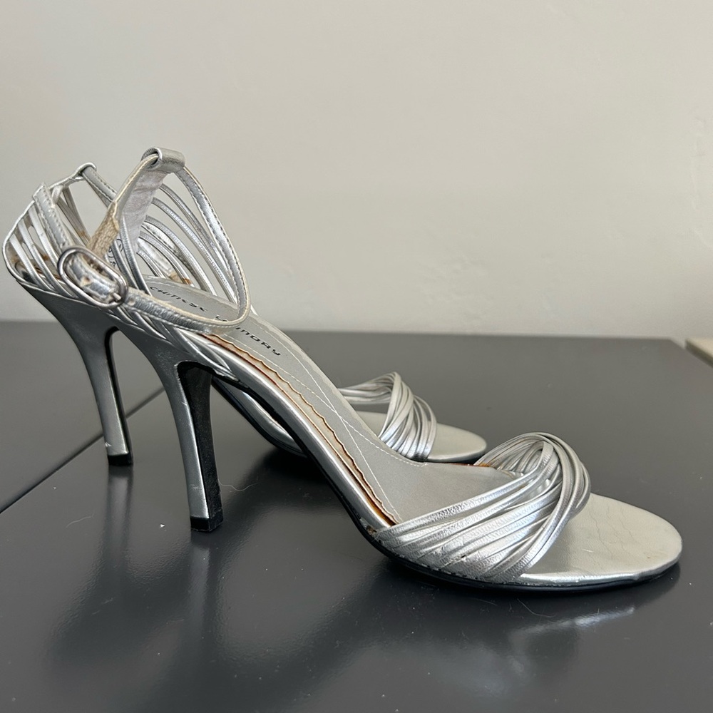 Women’s silver dressy heel with ankle strap. Size 6.5, heel 3 1/2